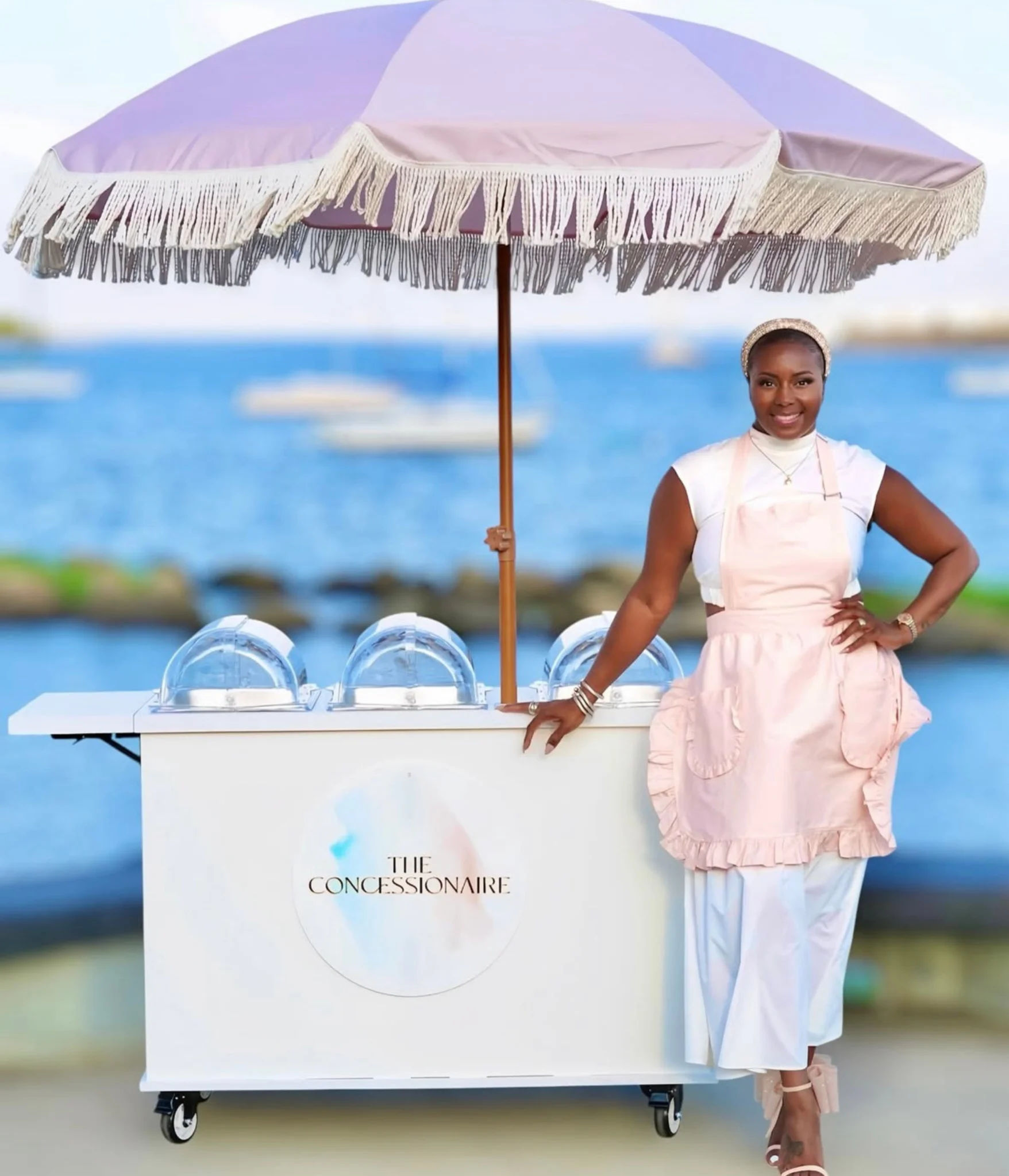 Outdoor mobile charcuterie cart catering by the water for a special occasion